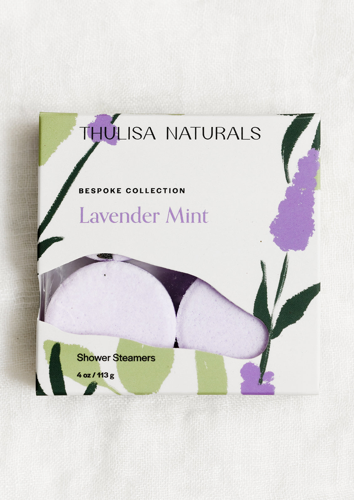 A box of shower steamer tablets in mint & lavender scent.