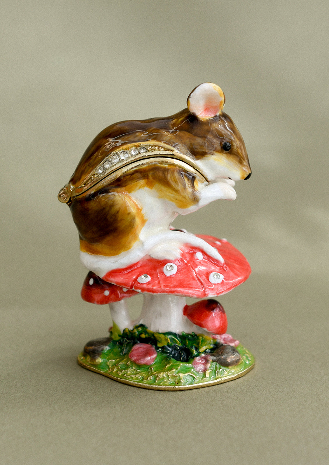 A crystal detailed metal trinket box depicting a wood mouse sitting on top of a red toadstool.