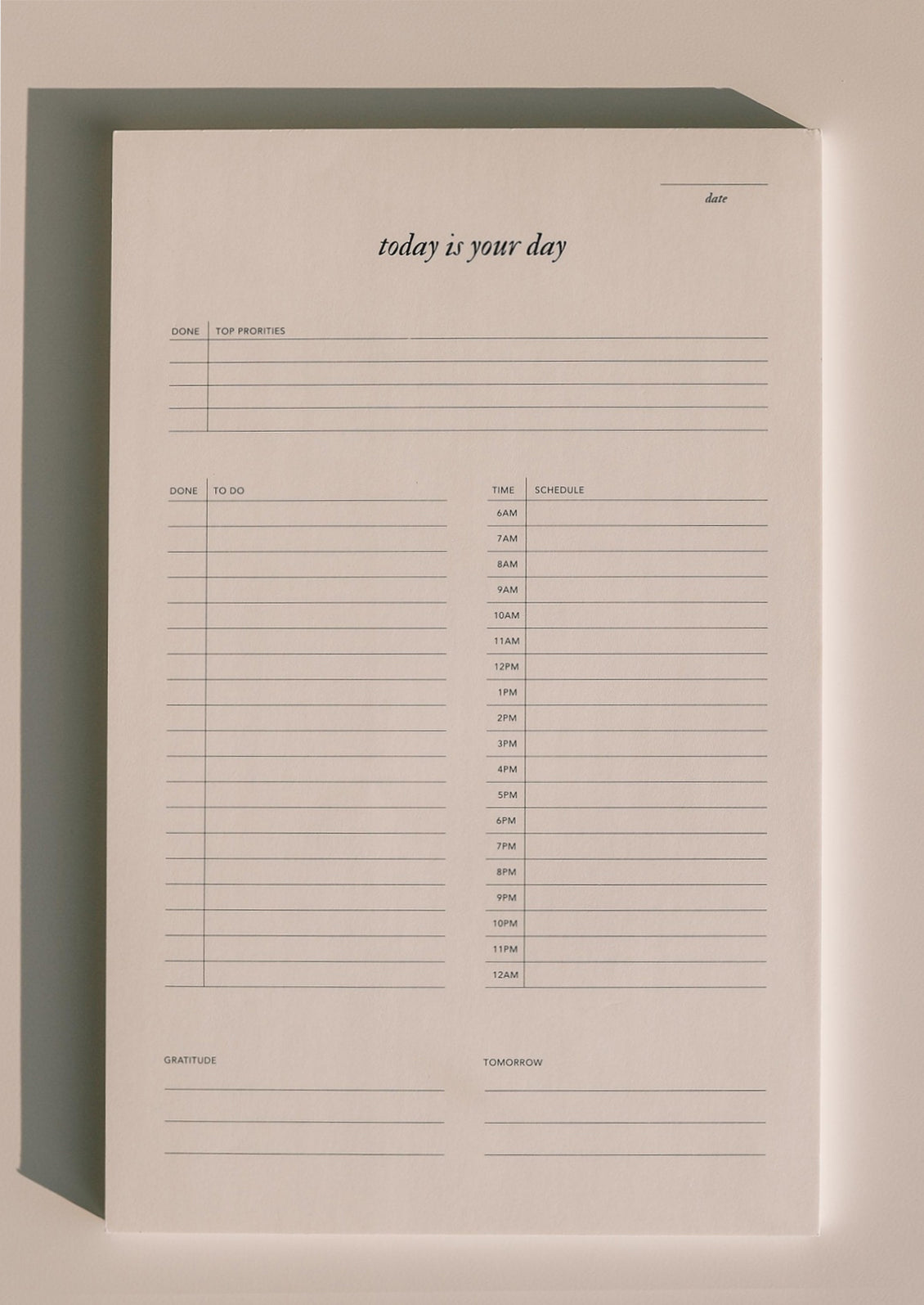 A to do list notepad reading "Today is your day".