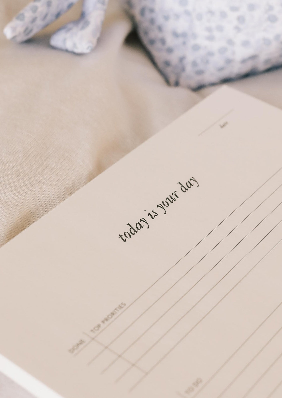 A to do list notepad reading "Today is your day".