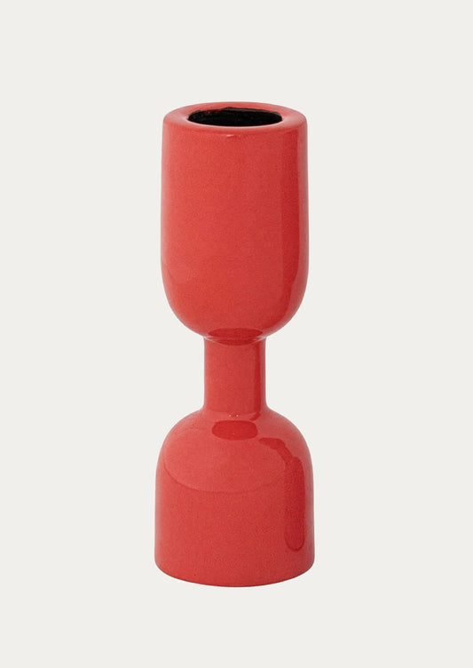 An enamel candle holder in red.