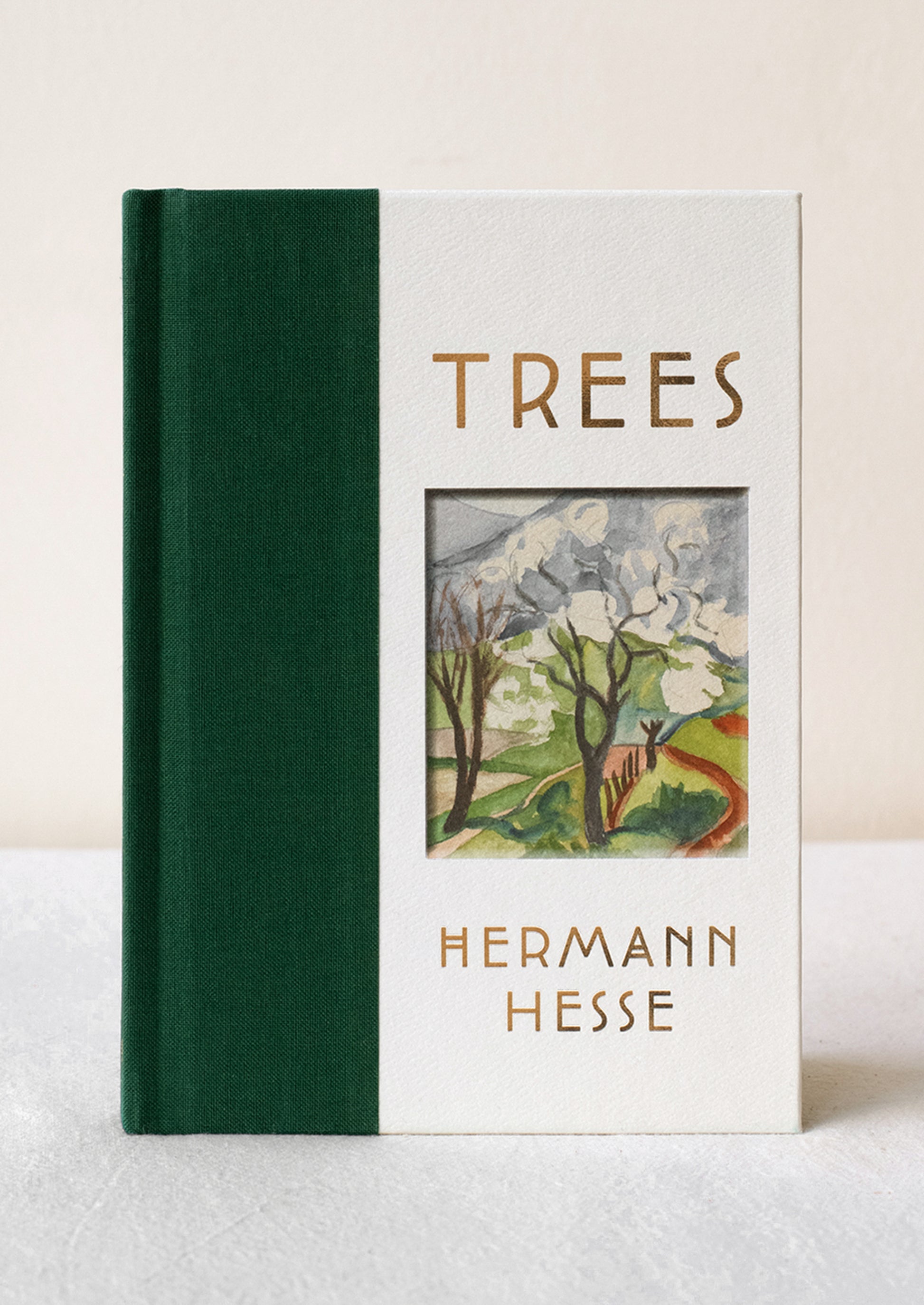 A hardcover book titled "Trees" with green cloth bound spine.