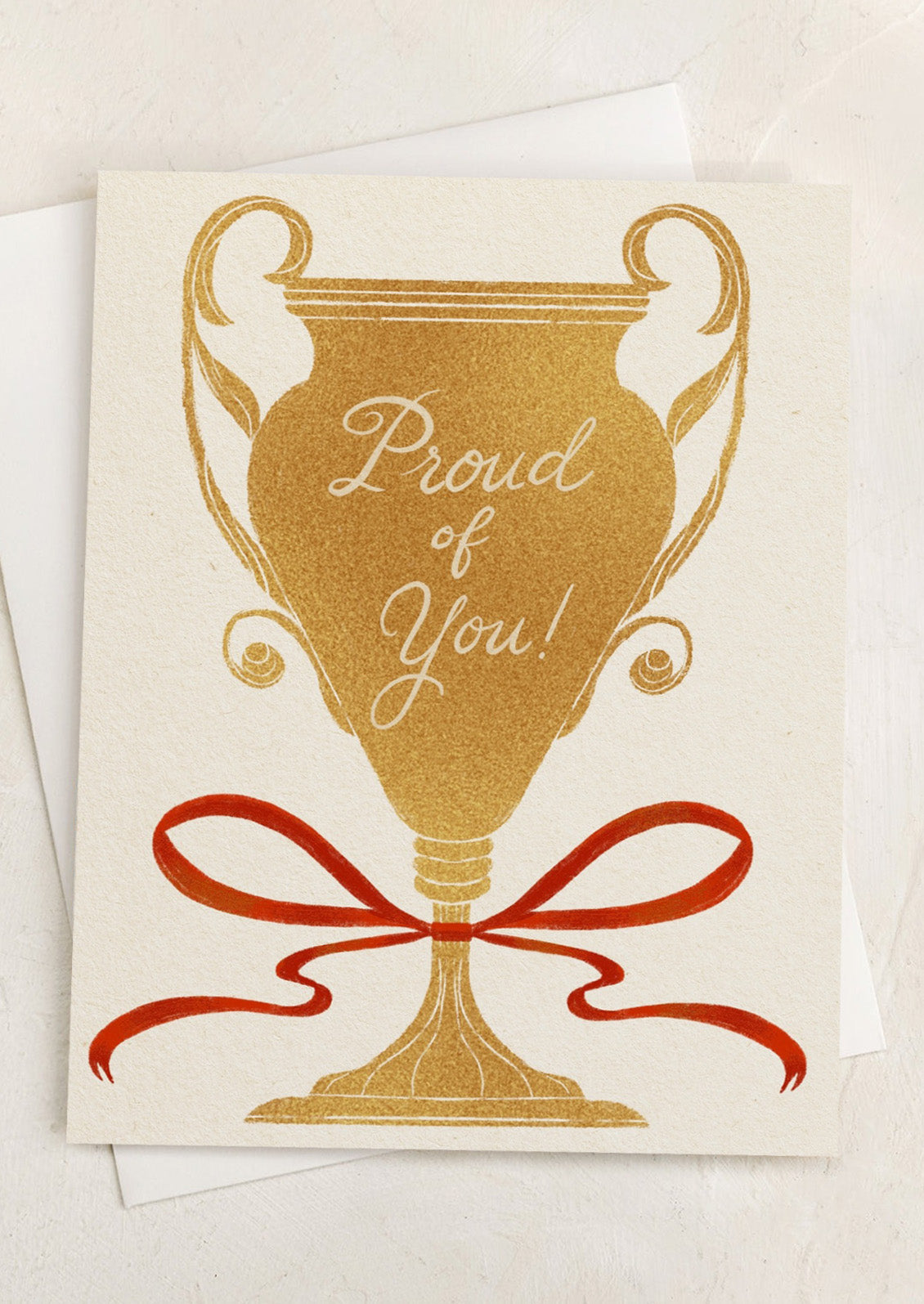A card with illustration of gold trophy tied with red ribbon, text reads "Proud of You!".
