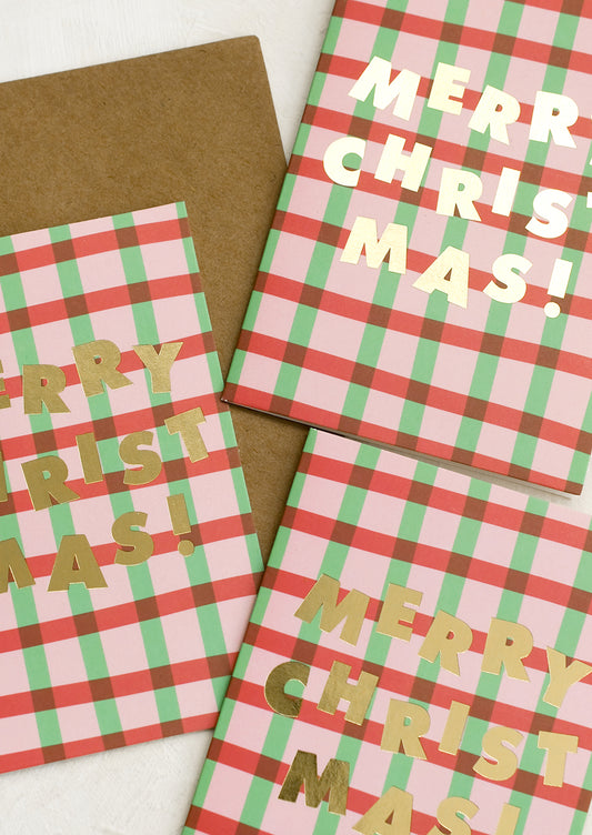 A set of red and green plaid Christmas cards.