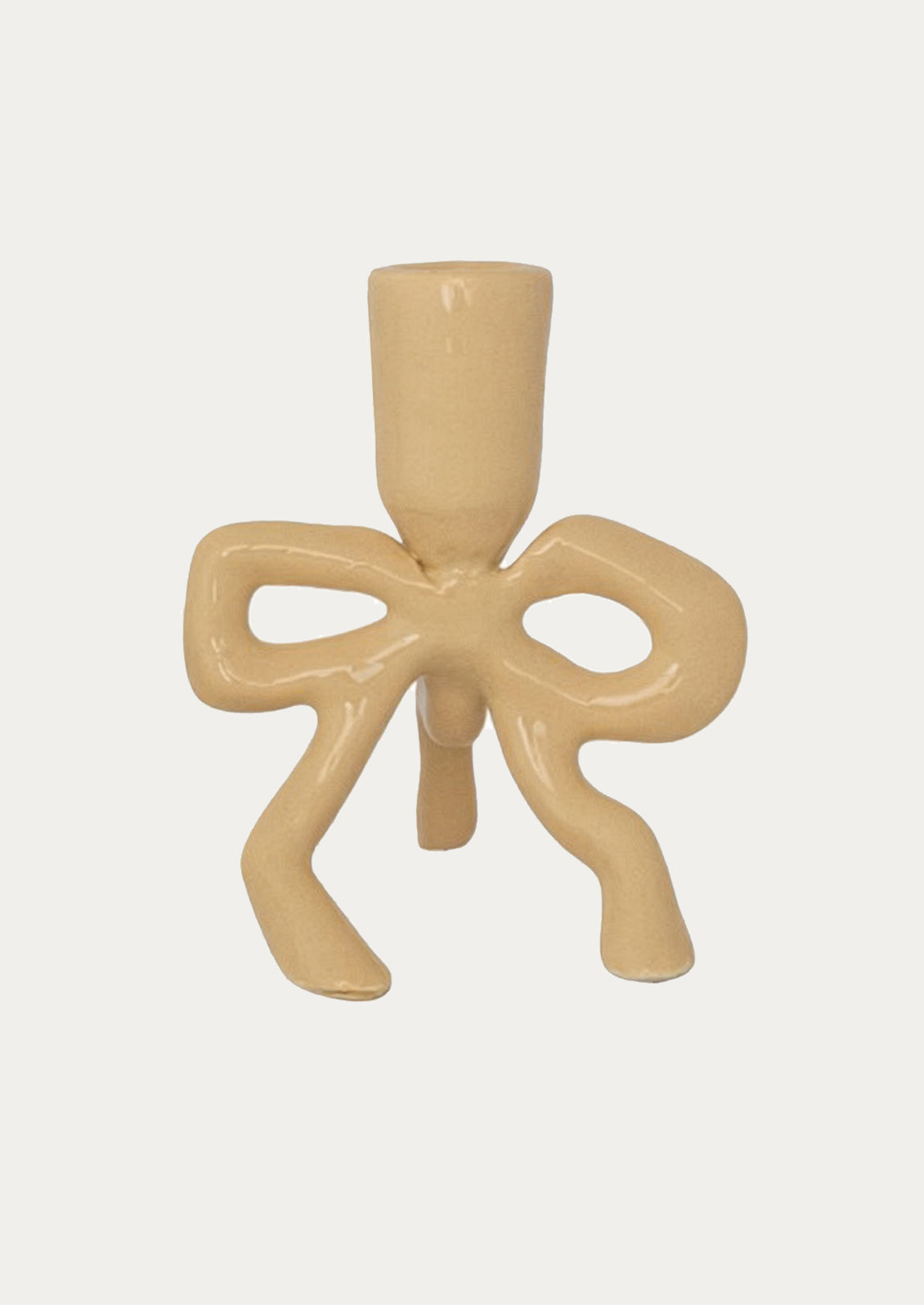 Beige candle holder with bow design on a white background