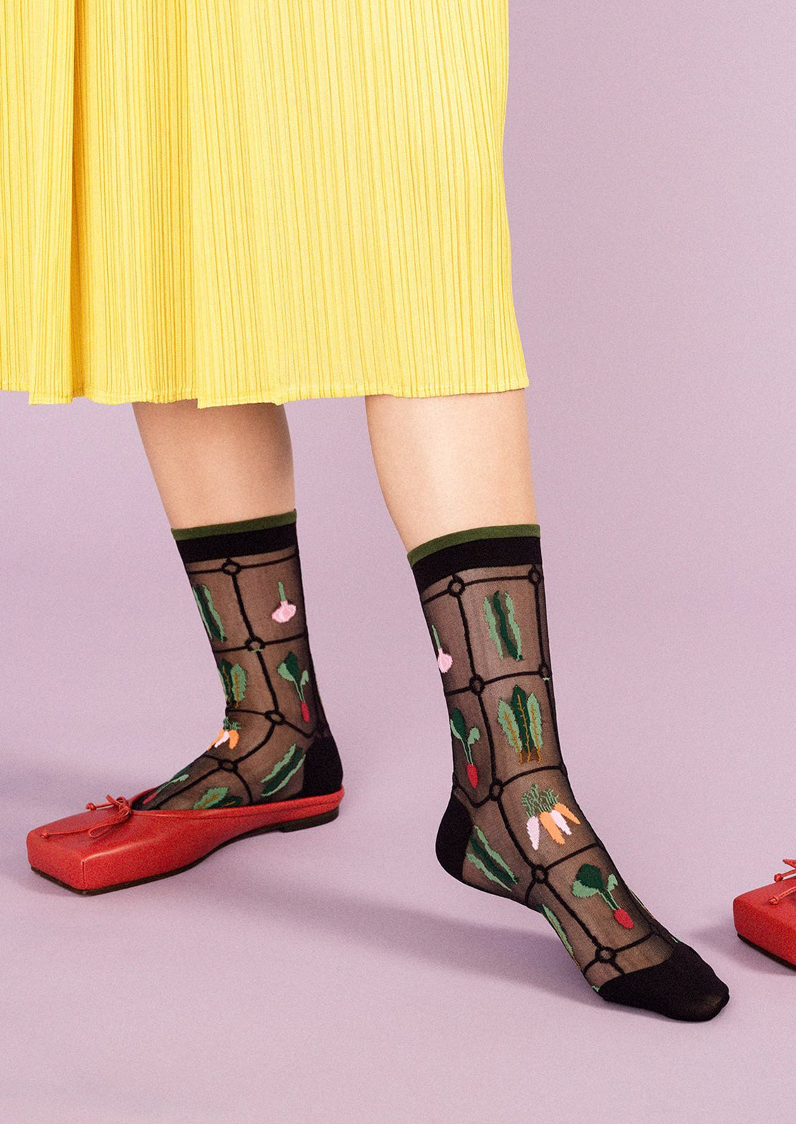 Sheer black nylon socks with multicolor veggie print.