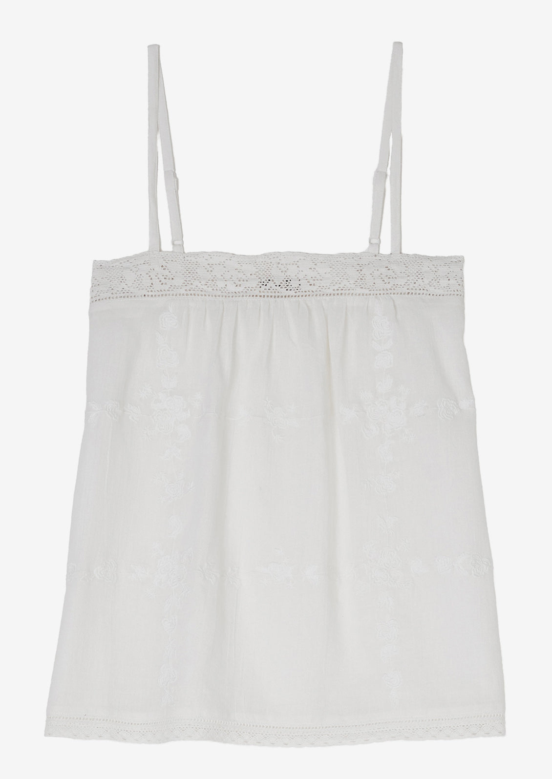 A white cami with tonal floral embroidery.