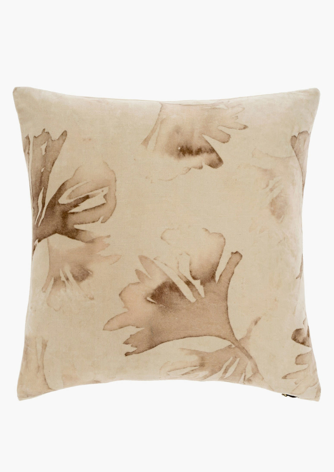 An ivory velvet throw pillow with brown eco natural leaf print.