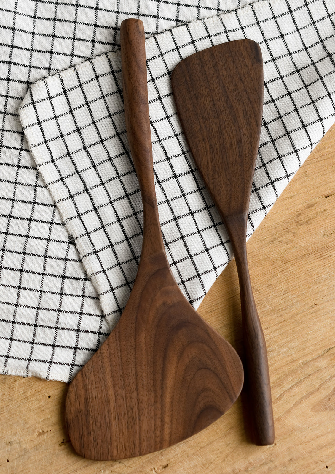 Walnut wood spatulas in two sizes.