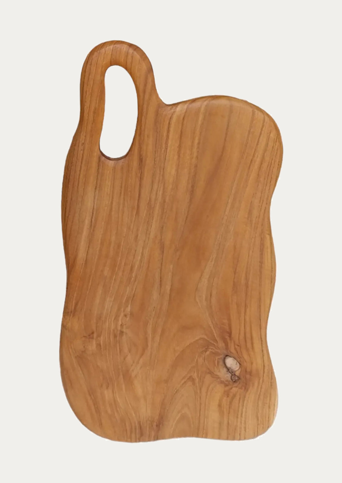 A cutting board with organic wavy shape.