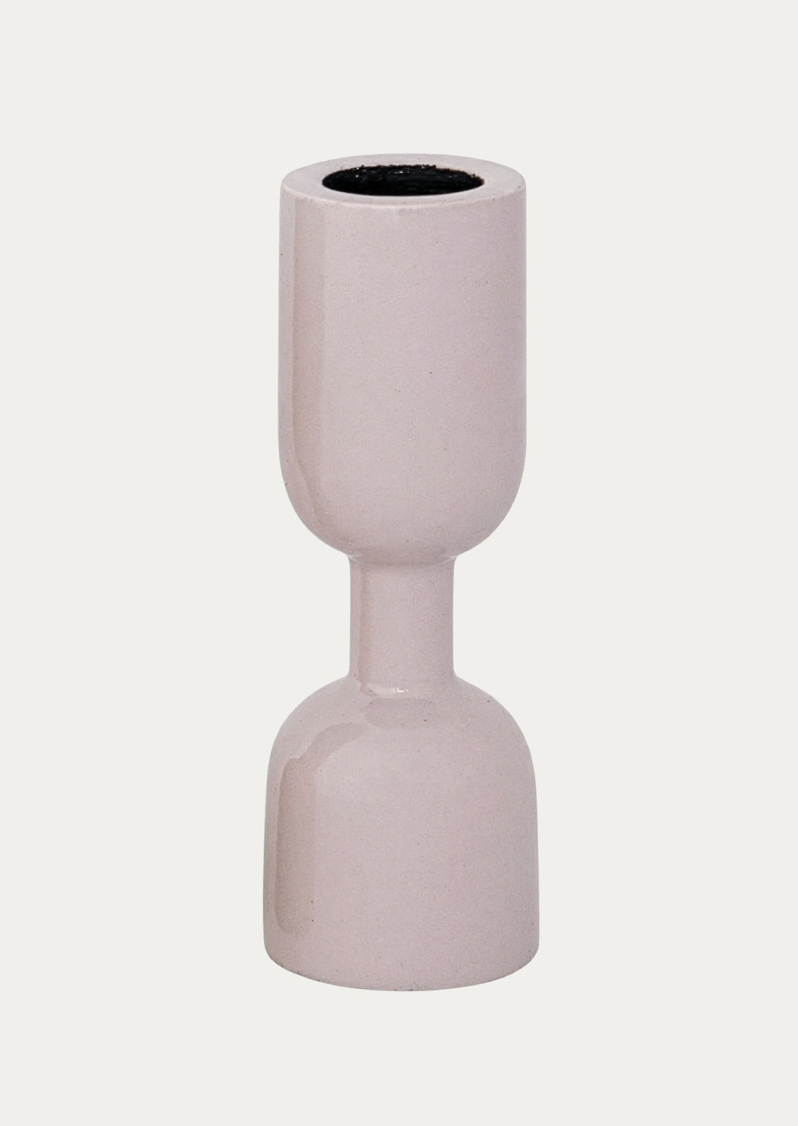 An enamel candle holder in pale pink.