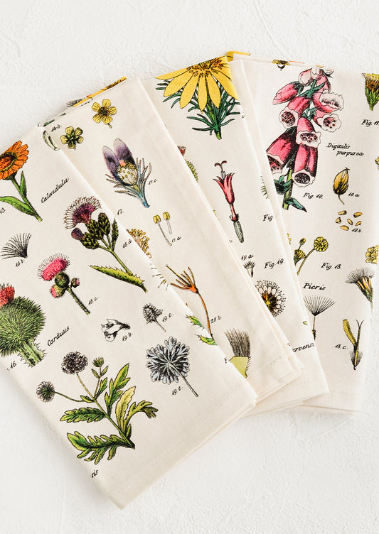 A set of four cotton napkins with colorful botanical wildflower print.