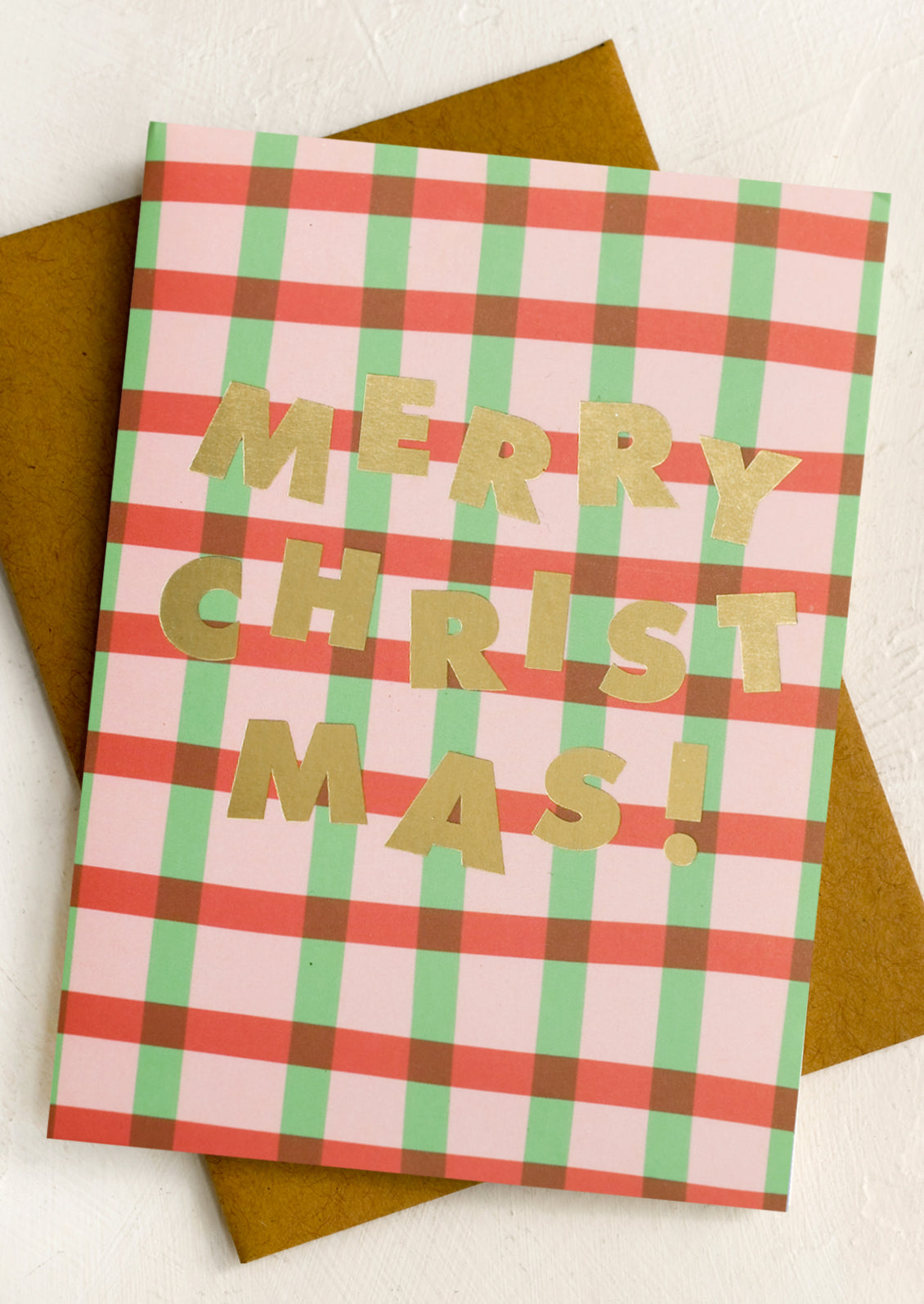 A set of red and green plaid Christmas cards.