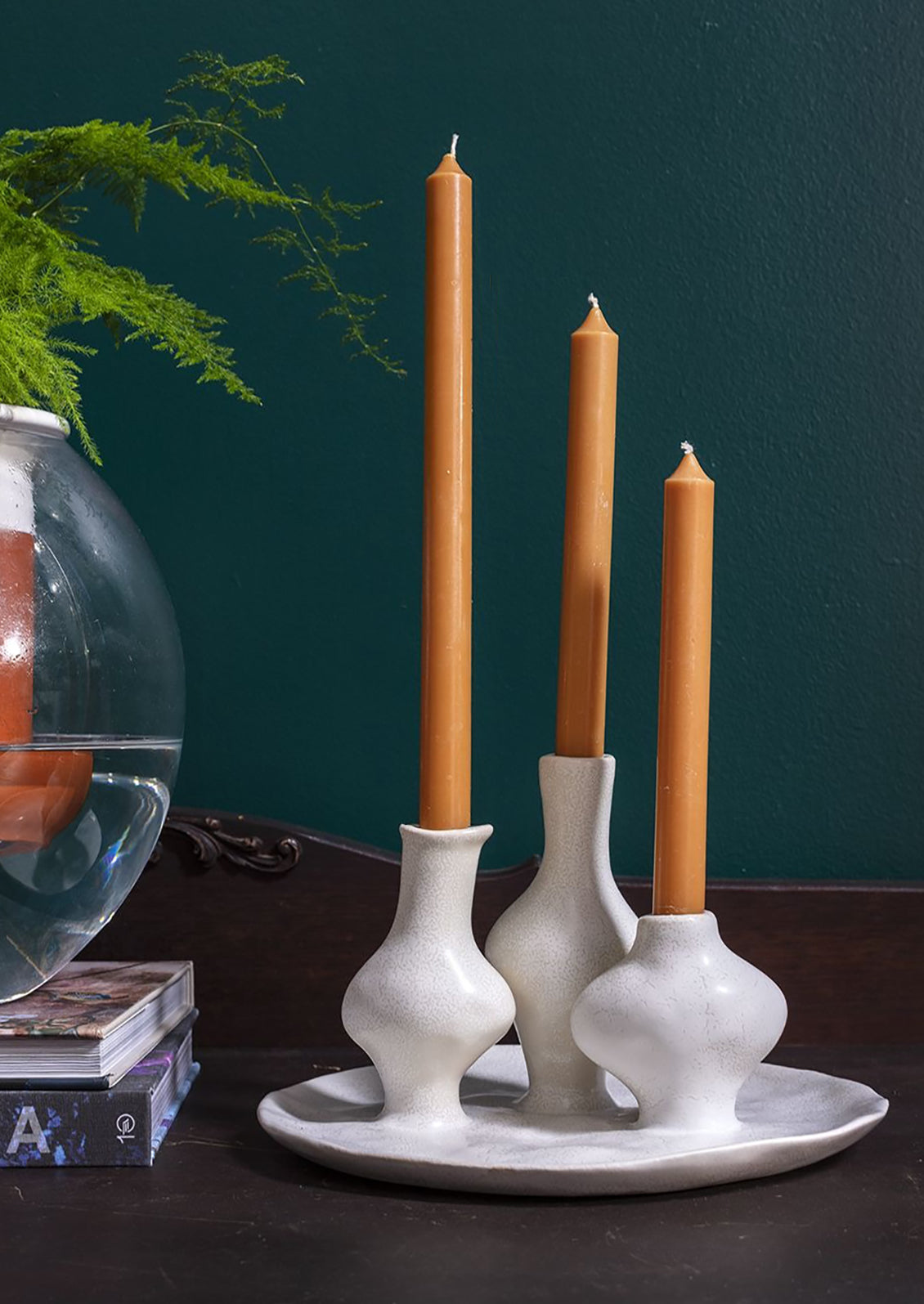 A sculptural multi vessel plate with bud vases in white ceramic.