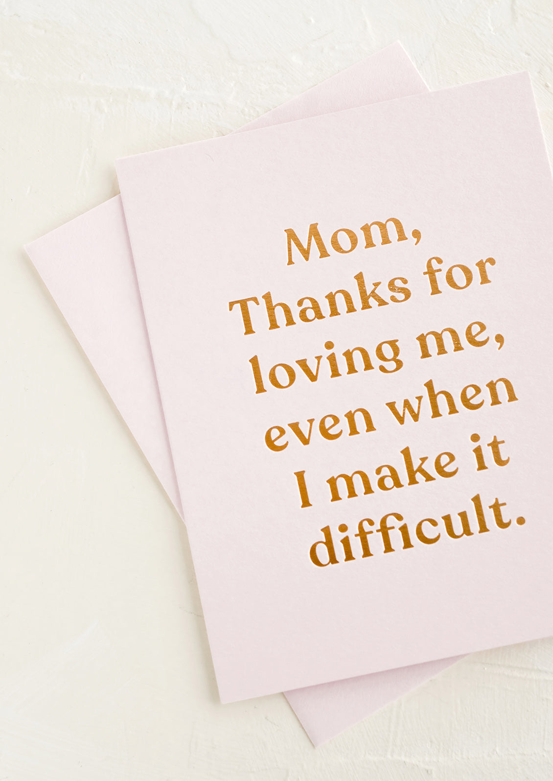 A greeting card that reads "Mom, thanks for loving me, even when I make things difficult".