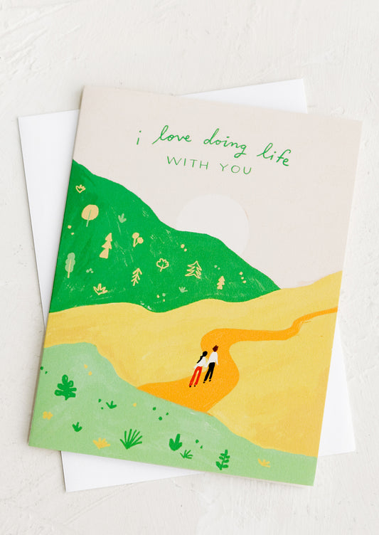 A card with illustration of two people hiking, card reads "I love doing life with you".