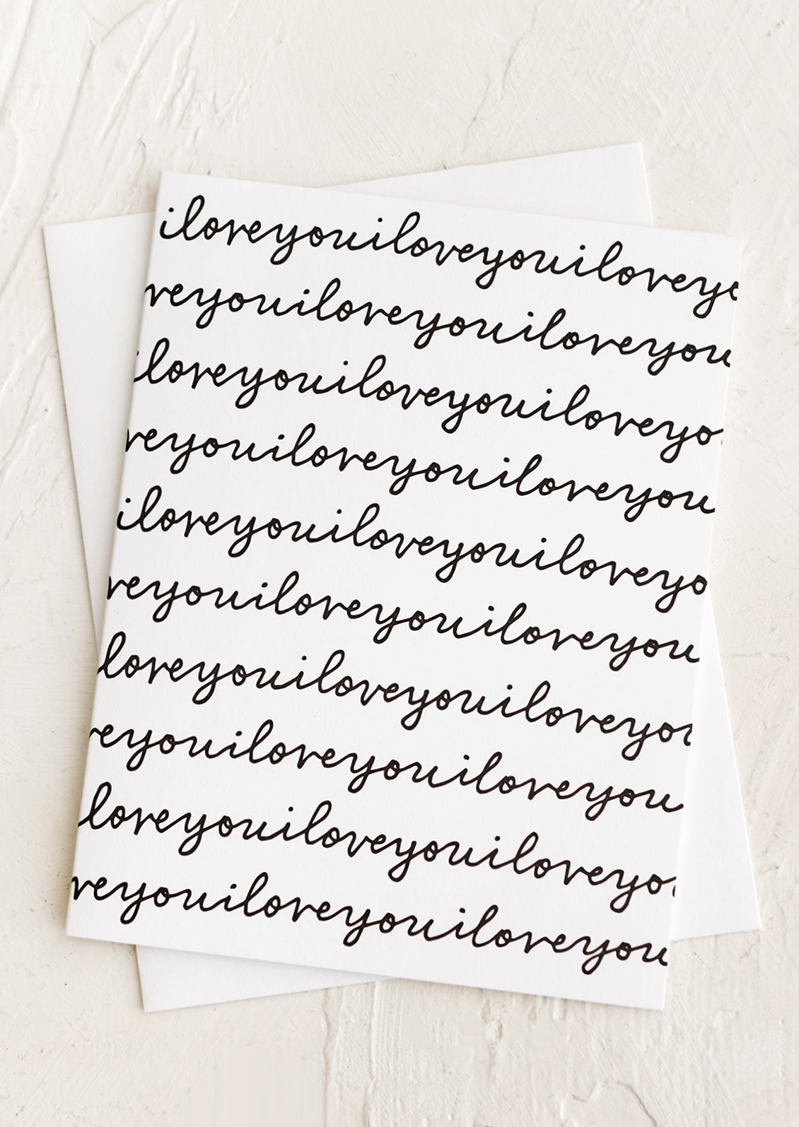 A card reading "I love you" repeating over the whole card.
