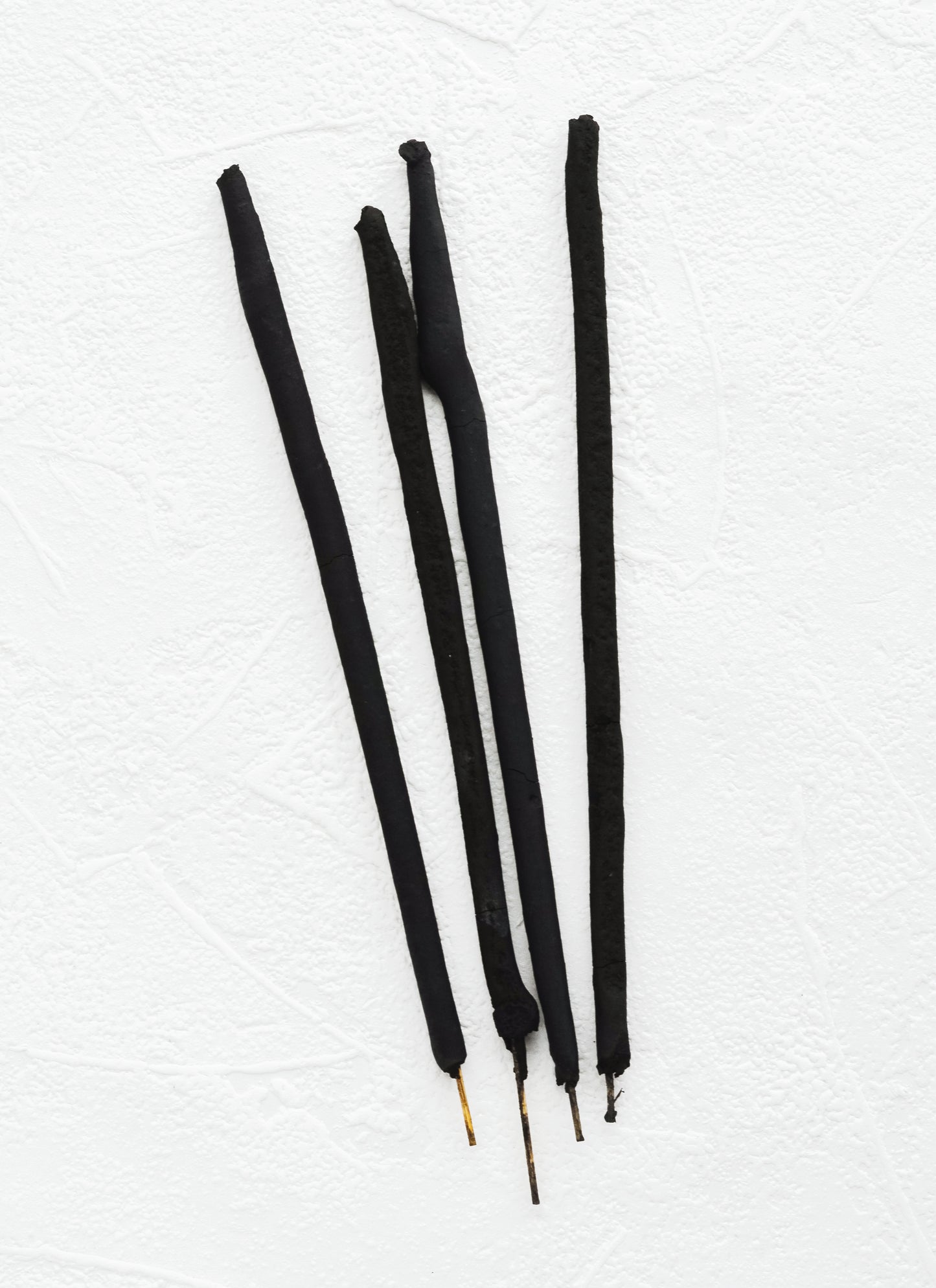 Black sticks of incense.
