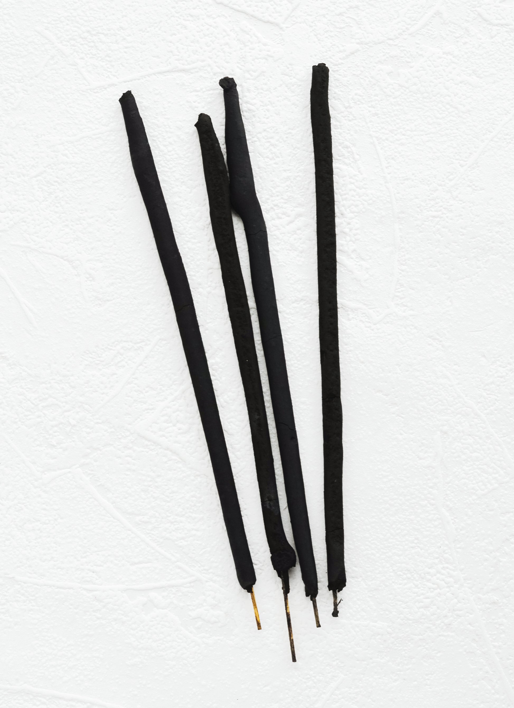 Black sticks of incense.