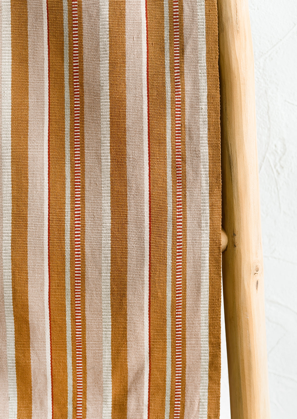 A close up of striped cotton fabric.