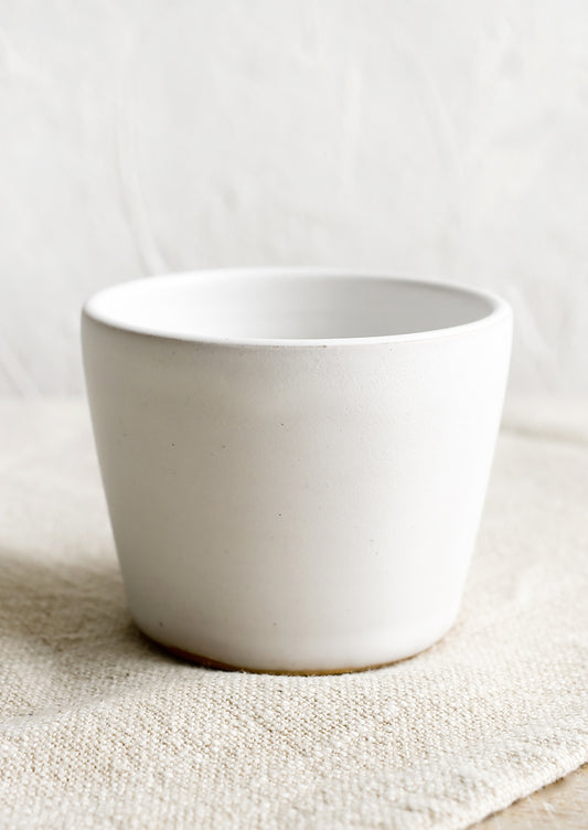 A ceramic espresso cup in matte white.
