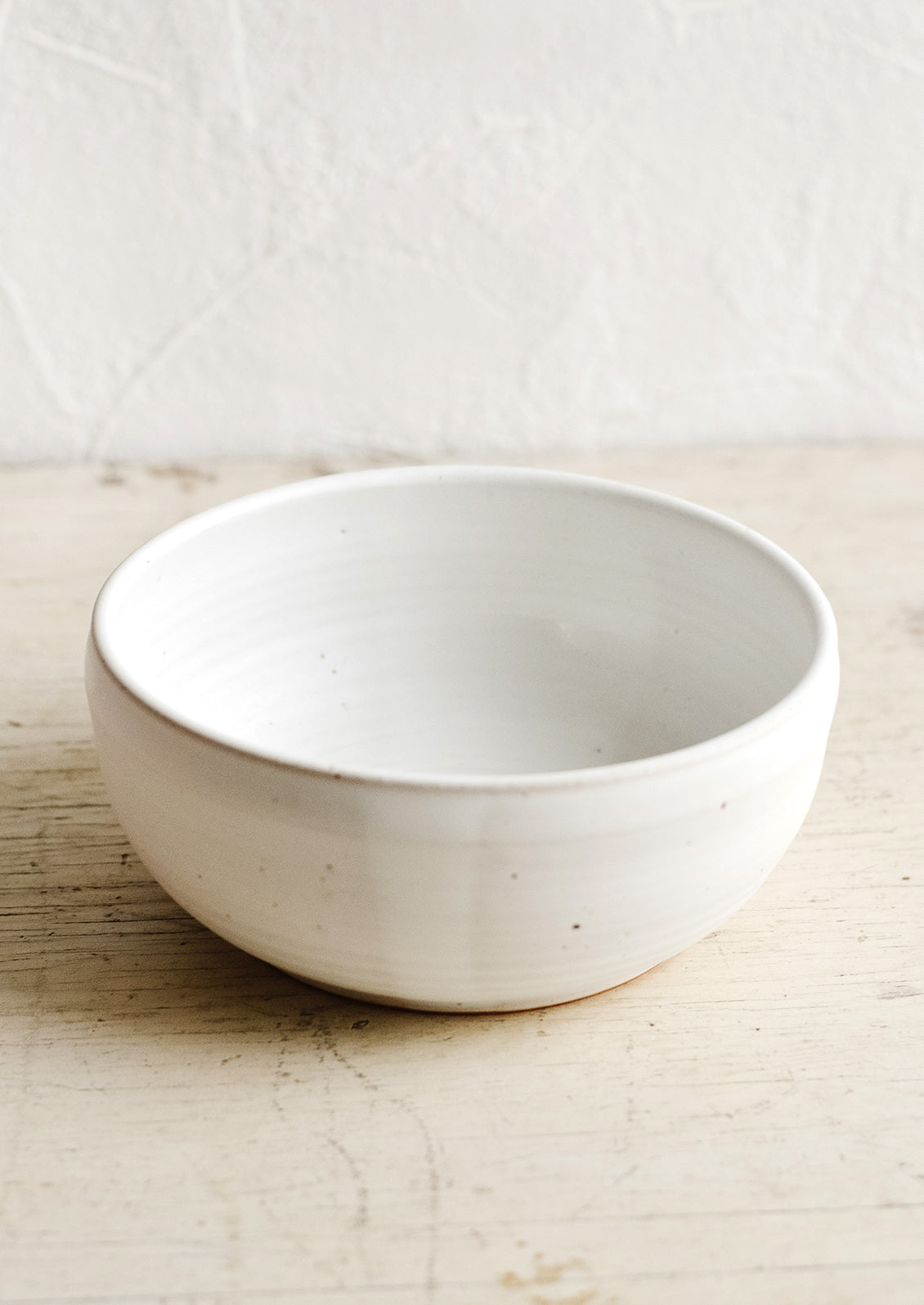 A ceramic soup bowl in a matte white glaze.