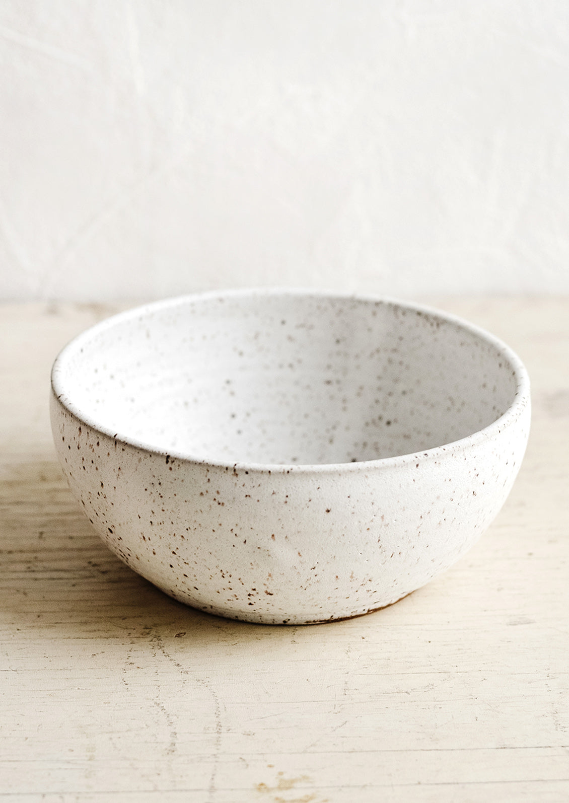A ceramic soup bowl in speckled matte white.
