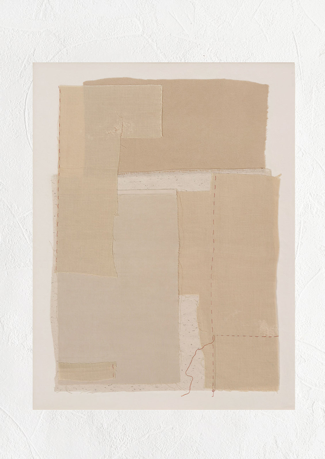 A photographic art print of layered beige fabric.