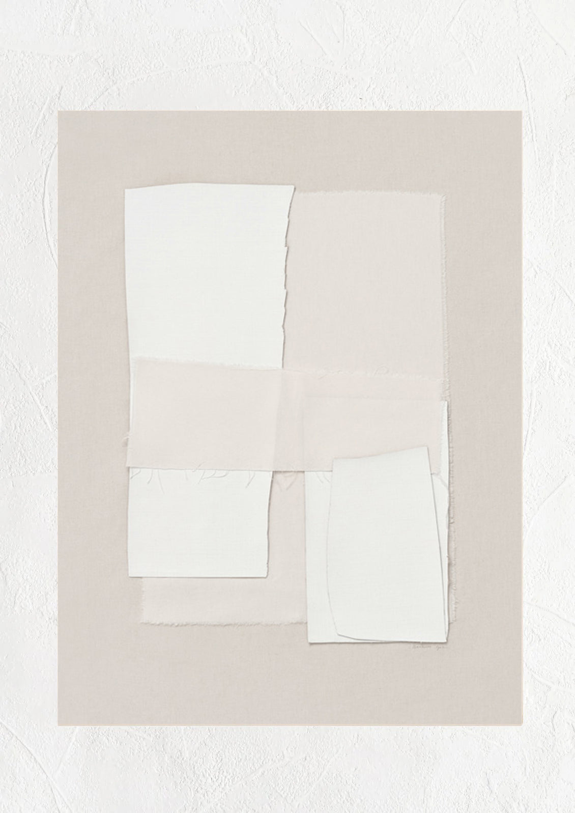 A beige art print with layered ivory textile.