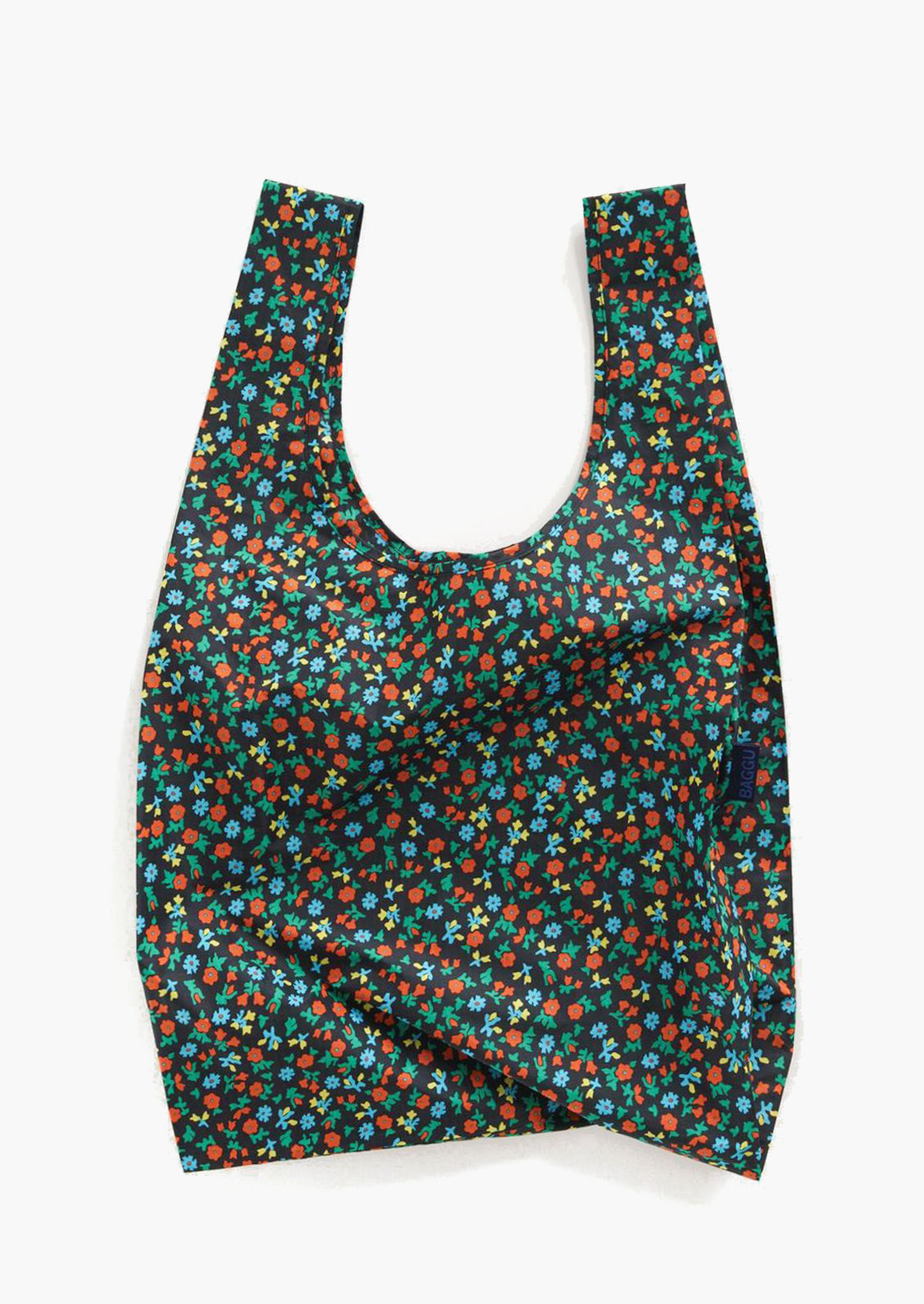 A reusable nylon bag in black calico floral print.