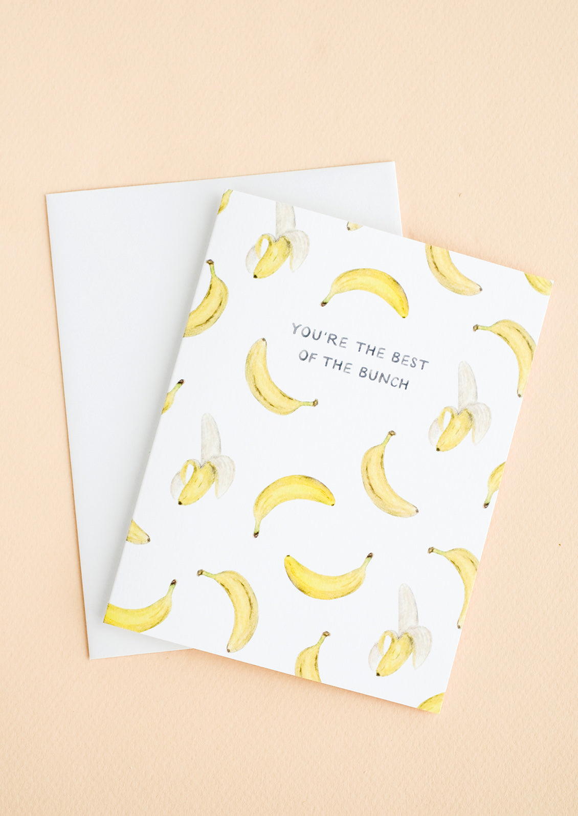 A greeting card with illustrated banana print and text at center reading "You're The Best Of The Bunch"