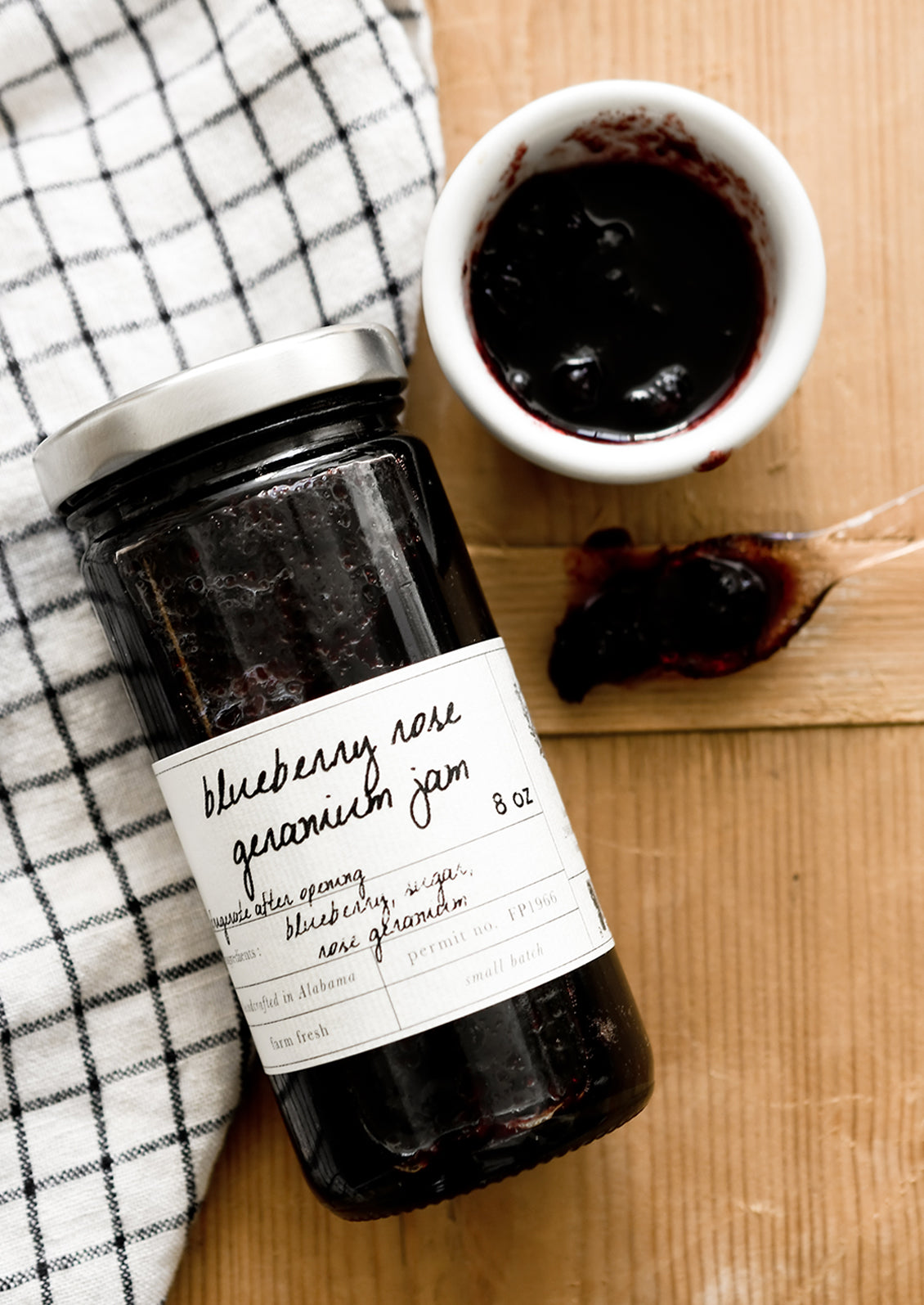 A glass jar of blueberry jam.