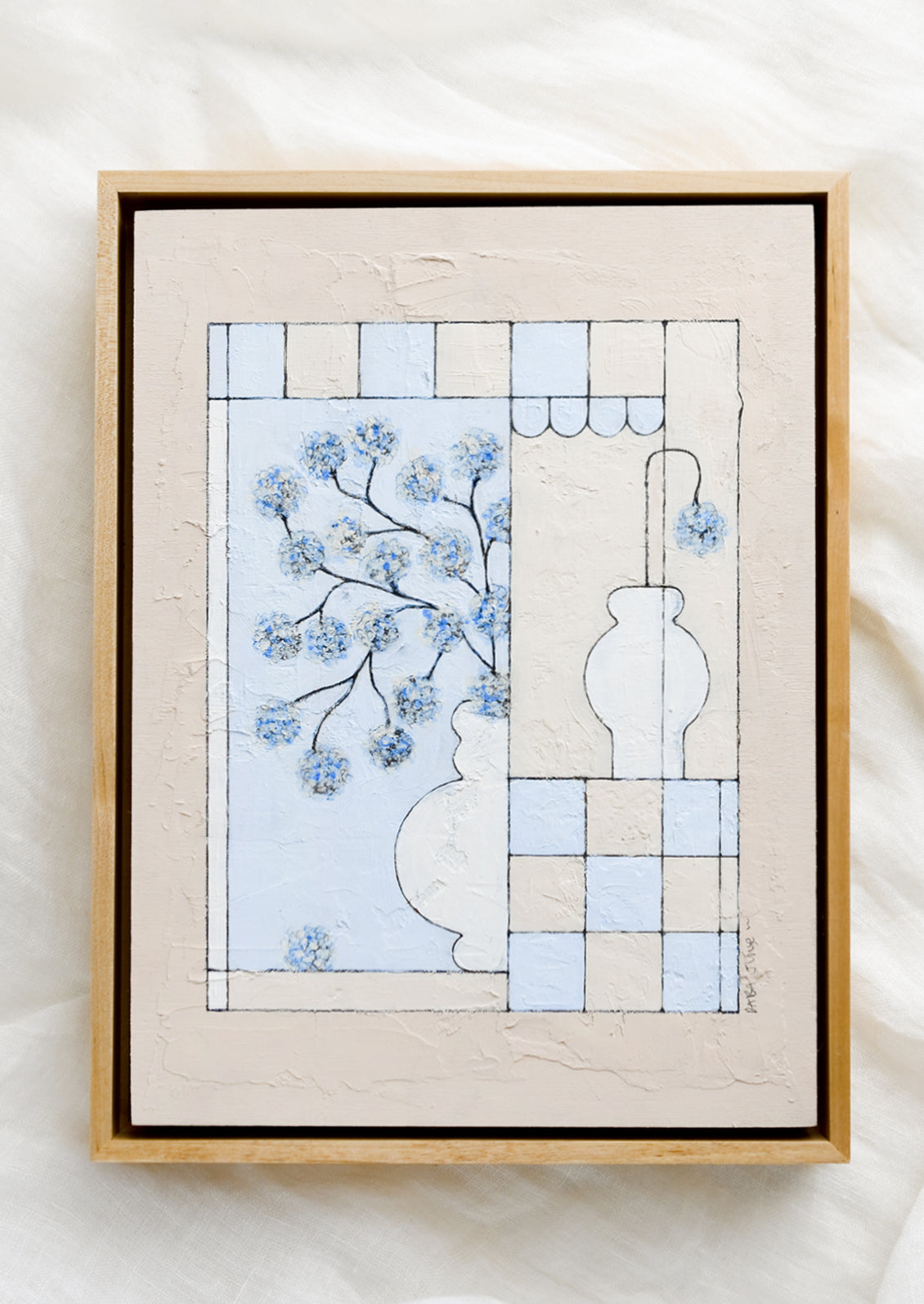A framed original still life painting in blue and beige.