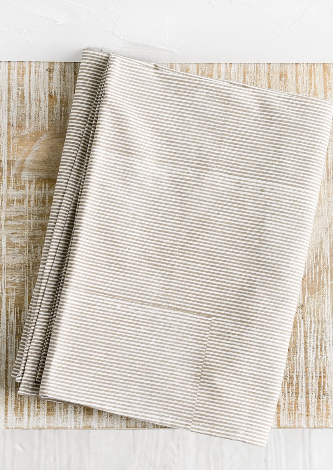 A stripe pattern tablecloth in mocha.