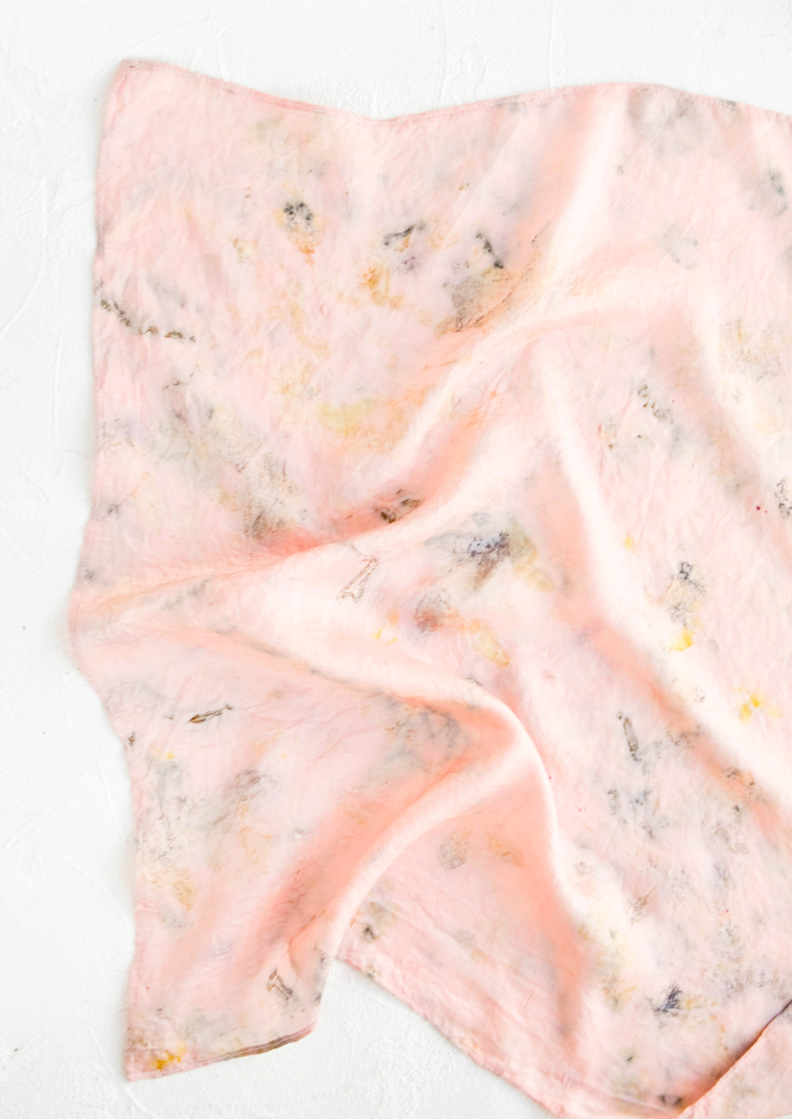 Botanically dyed, one of a kind silk scarf with randomized splatters of color. Pink with faint yellow and grey.