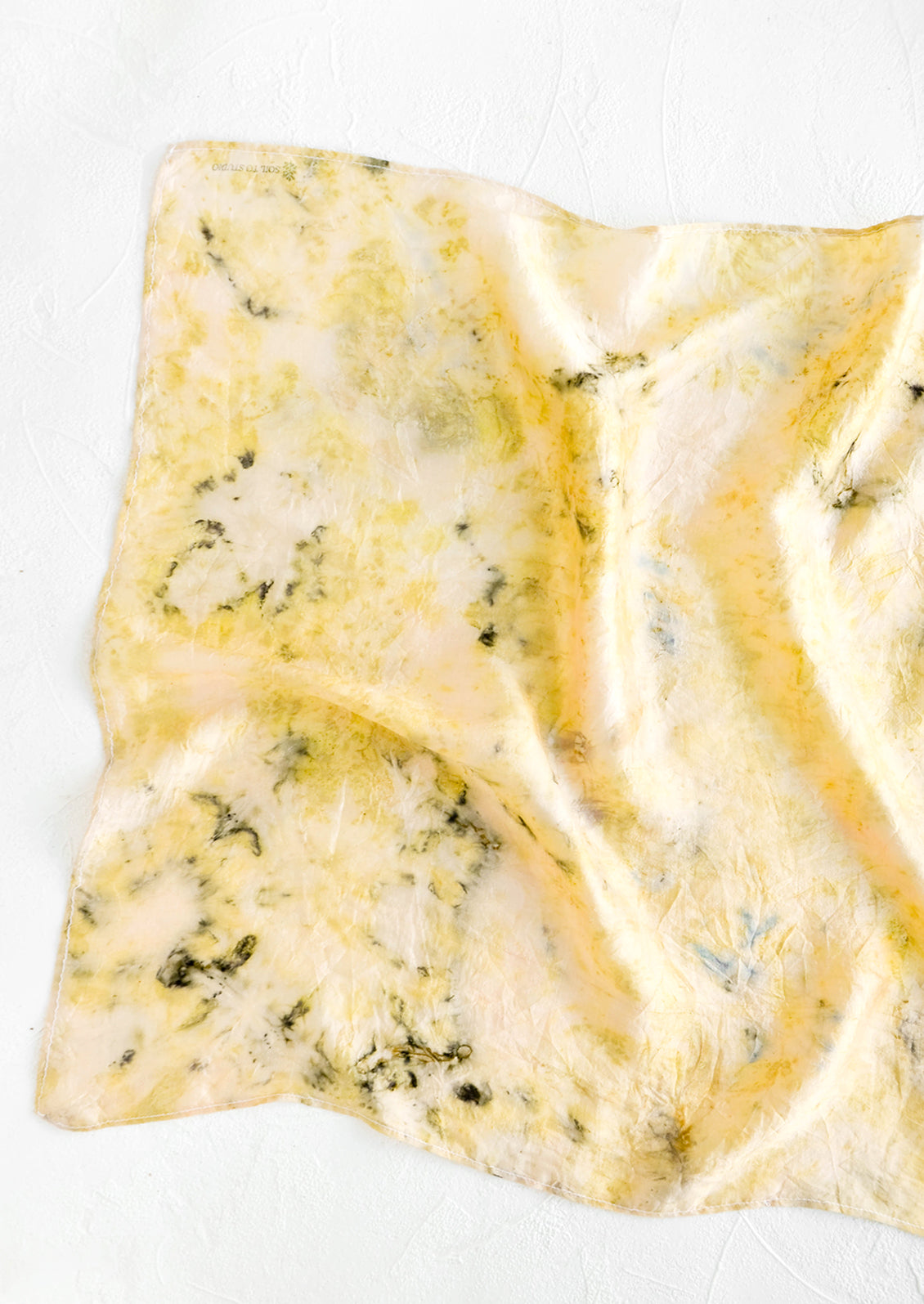 Botanically dyed, one of a kind silk scarf with randomized splatters of color. Yellow with black.