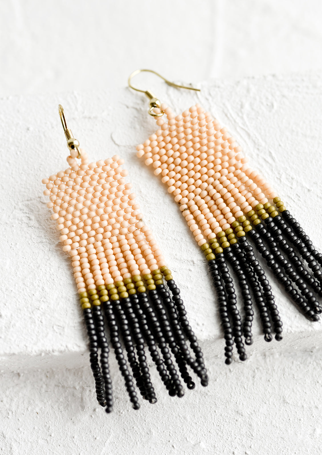 A color blocked pair of beaded earrings.