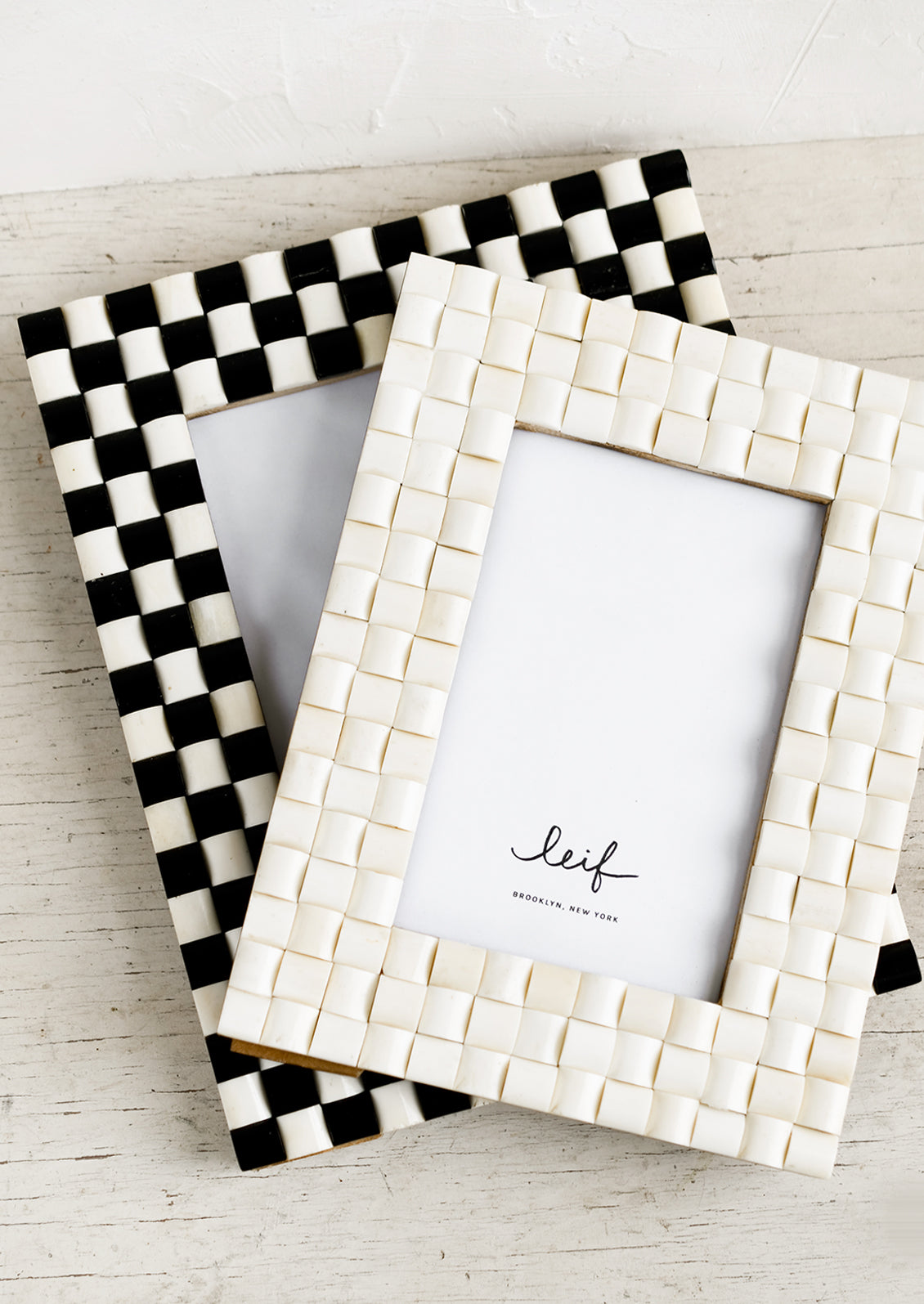 Assorted checker weave picture frames.