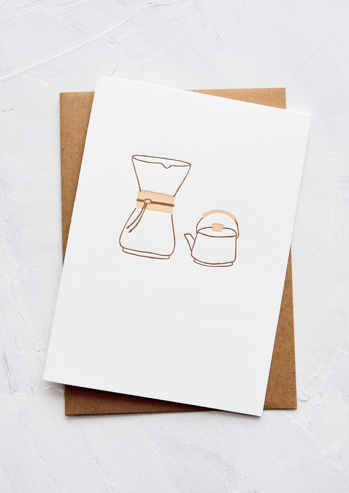 A letterpress printed greeting card with an image of a chemex coffee pourover and a kettle