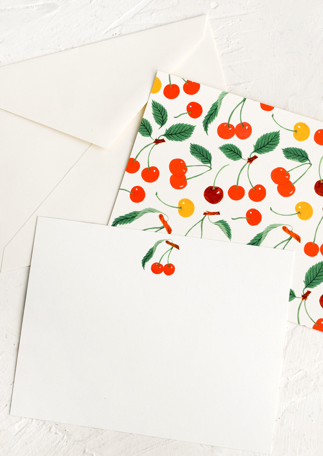 A notecard set with two-sided cherry design.