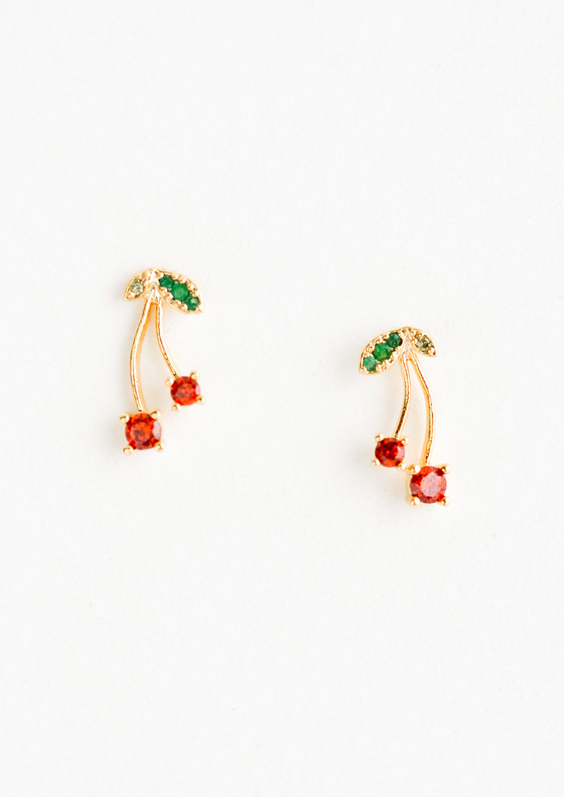 A pair of gold stud earrings in cherry design.