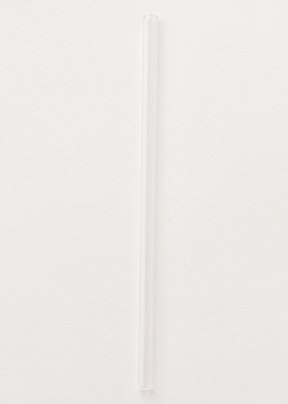 A clear glass straw.