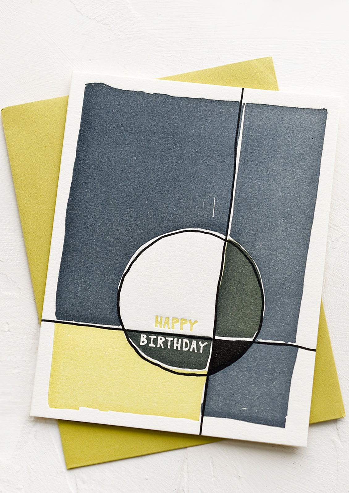 A birthday card with abstract design in blue and green.