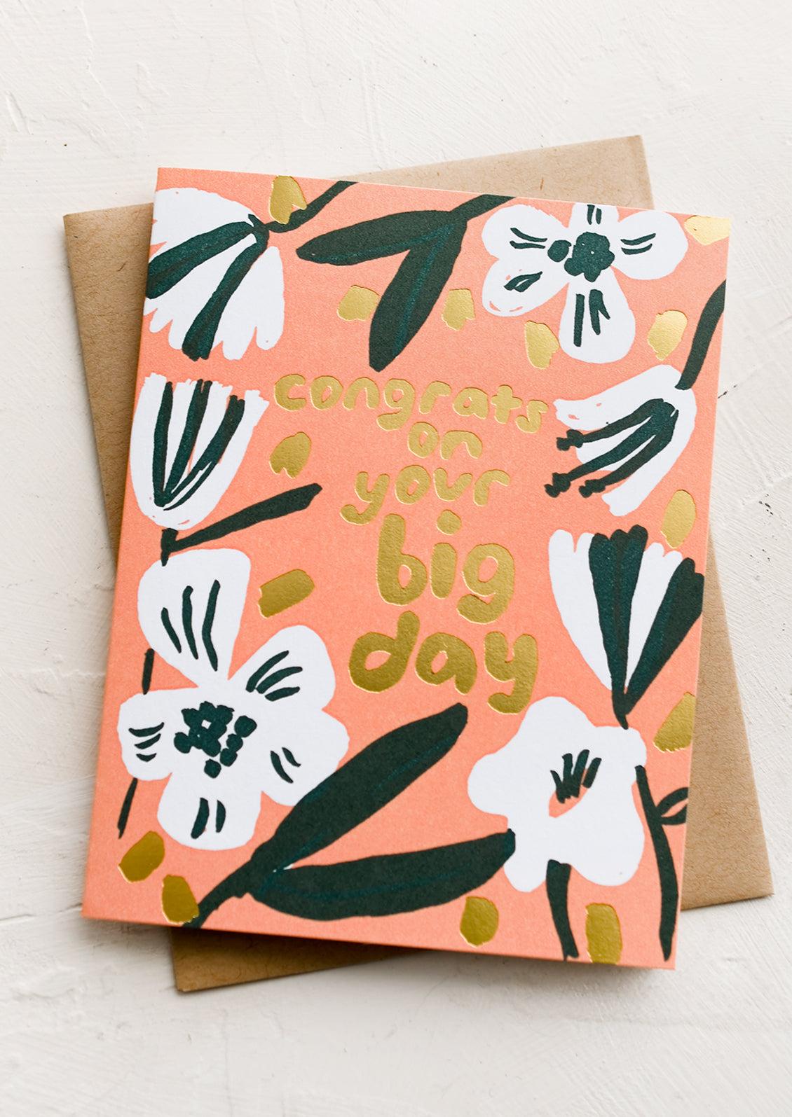 A peach floral card reading "congrats on your big day".