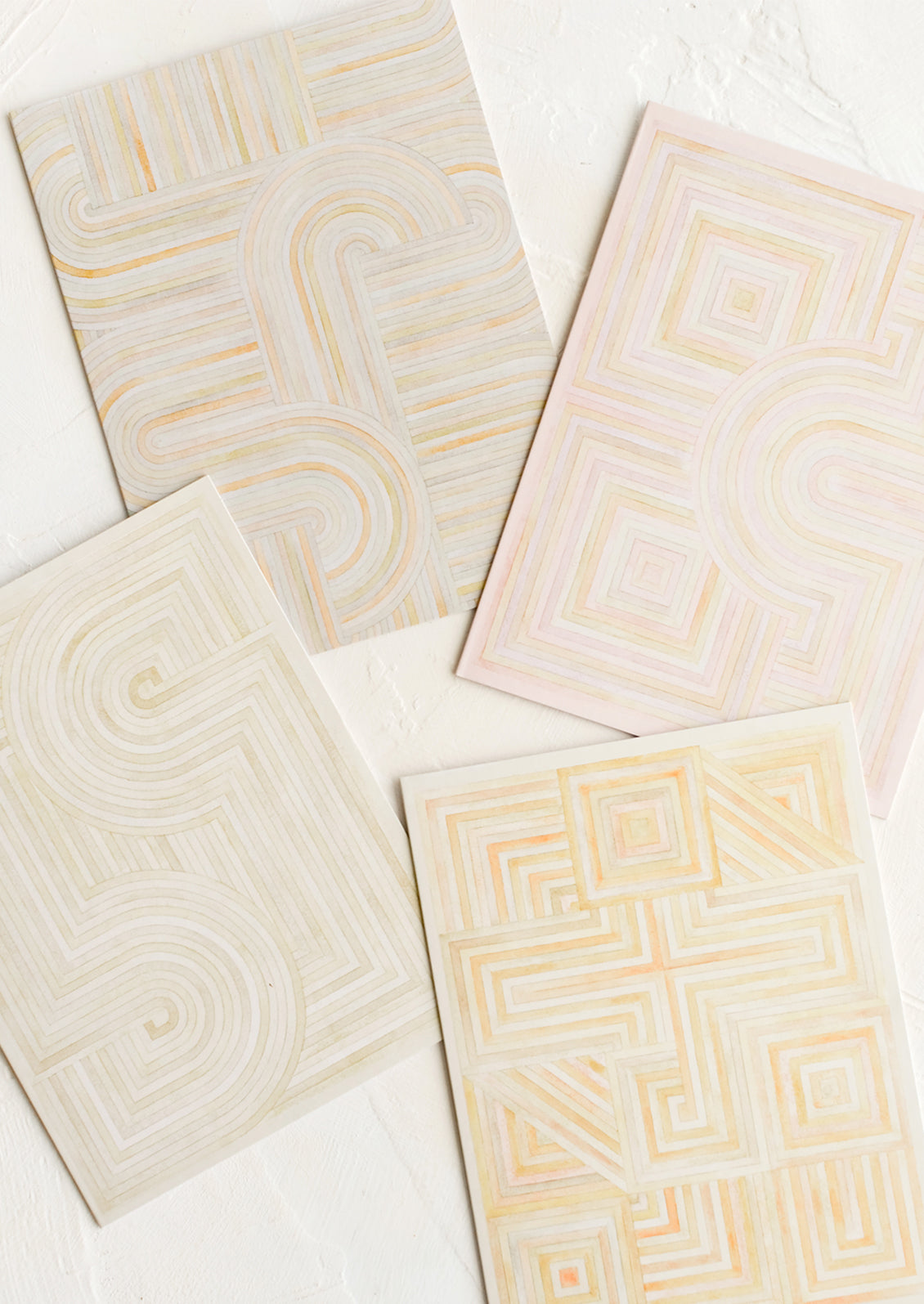 Four notecards with pastel geometric artwork design.