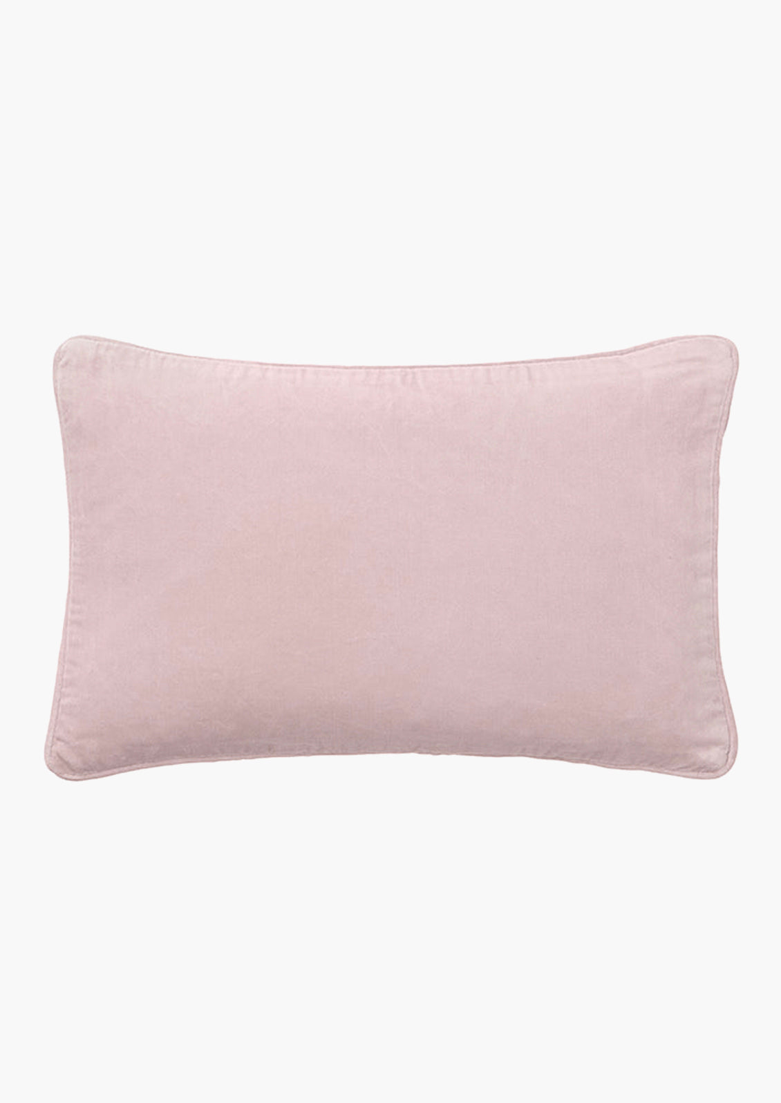 A lumbar velvet throw pillow in dusty rose.