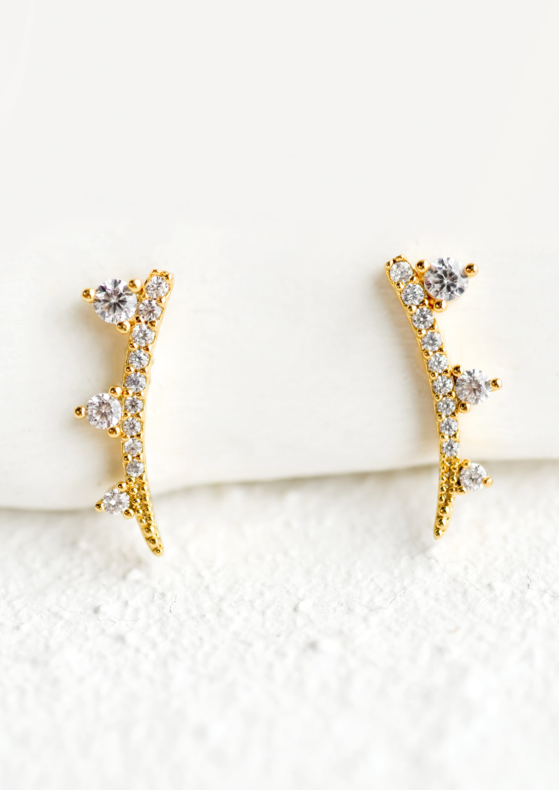 A pair of crystal stud earrings with spike shape.