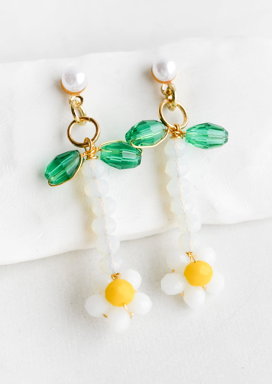 Beaded flower earrings in white with pearl post.