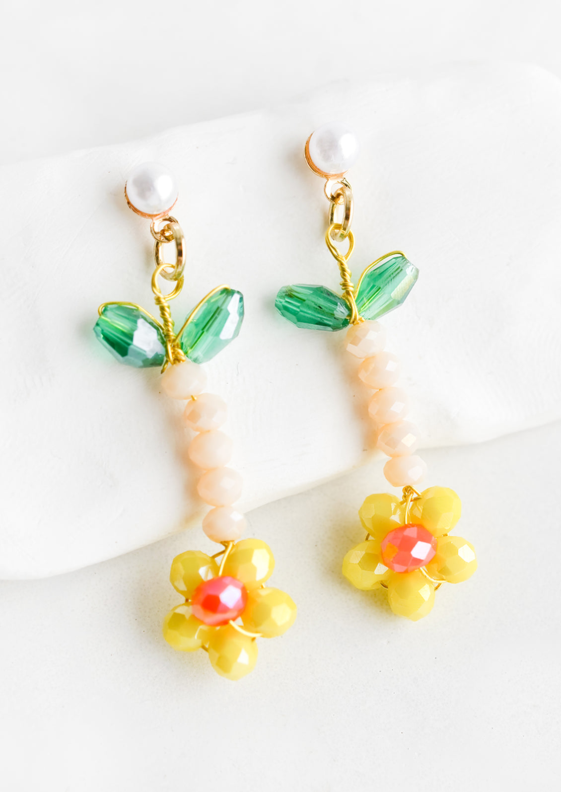 Beaded flower earrings in yellow with pearl post.