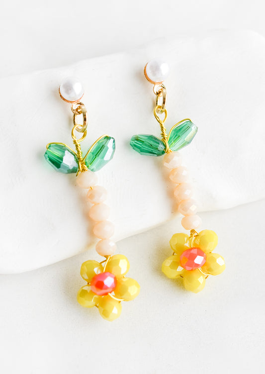 Beaded flower earrings in yellow with pearl post.